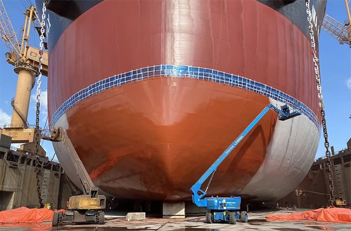 Ship hull coating at dry dock